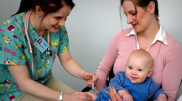 Doctor giving baby immunisations