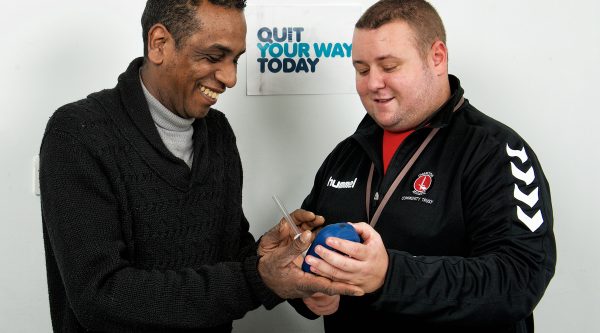 A man who smokes taking lung age test as part of his stop smoking support